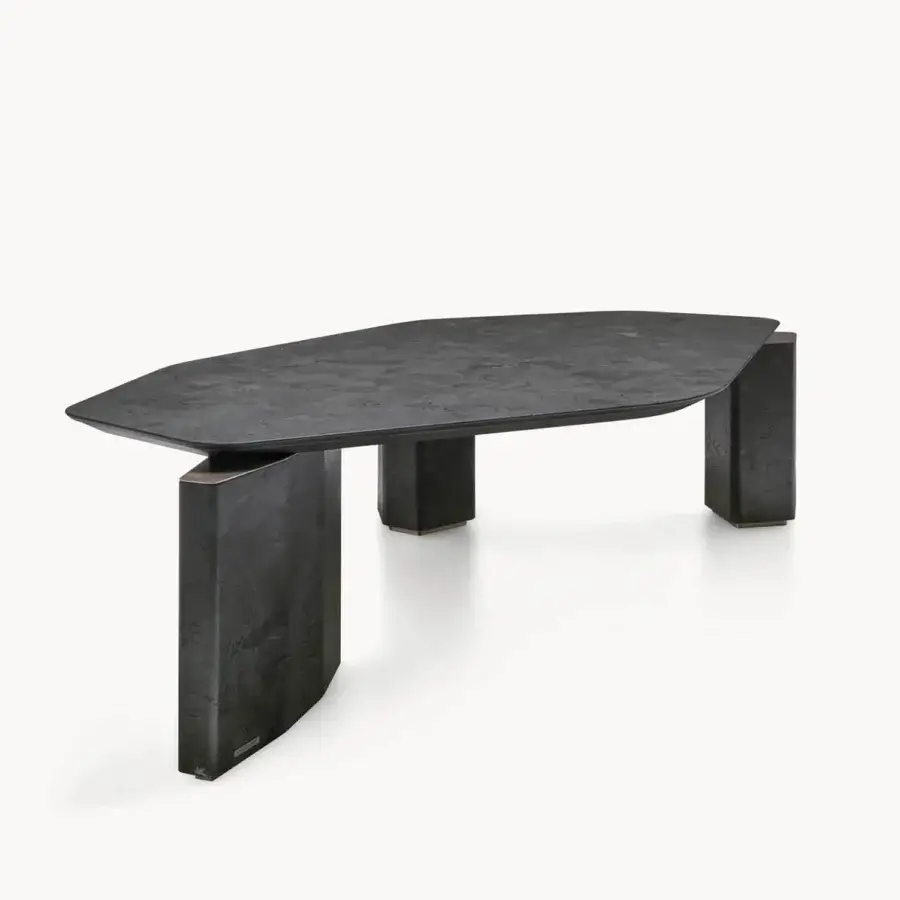 Luxury Visionnaire Titan Table with polished charcoal‑gray marble top, bronze‑colored metal joints, three asymmetrical legs
