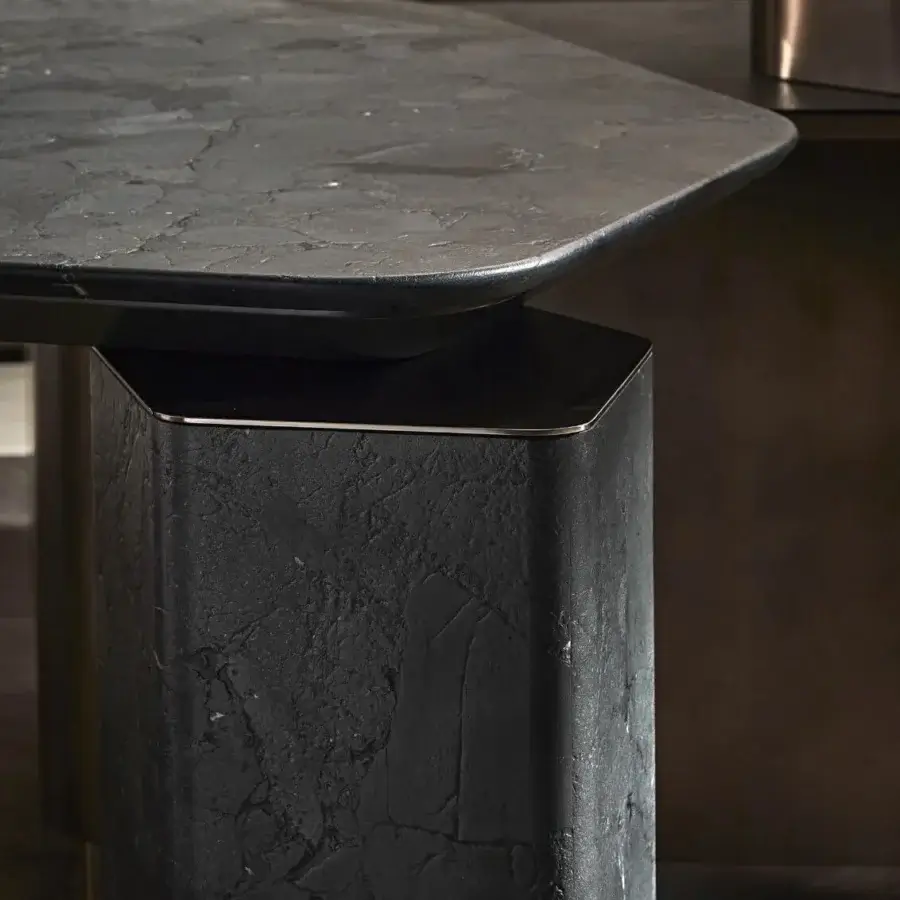 Elegant table with polished premium marble charcoal surface, subtle veining, glossy metal trim and architectural lines