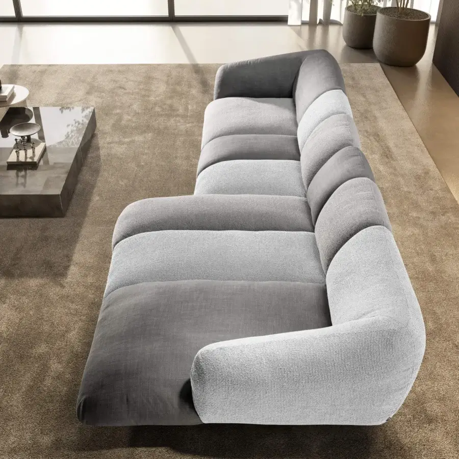 Sophisticated Lago Not Only White sectional in textured textile with dark and light grey panels and low-profile silhouette