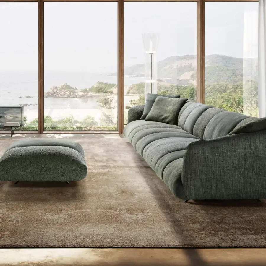 Elegant sectional in muted sage‑green with woven textile upholstery and matte finish, contemporary organic silhouette smooth curved lines