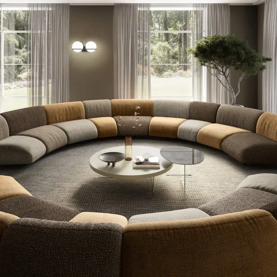 Premium circular sectional in matte textile with brown ochre yellow and light grey modules and soft rounded edges