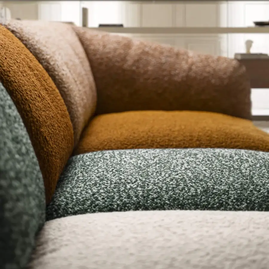 Luxury Lago Not Only White sectional with matte nubby textile in dark green ochre tan off‑white