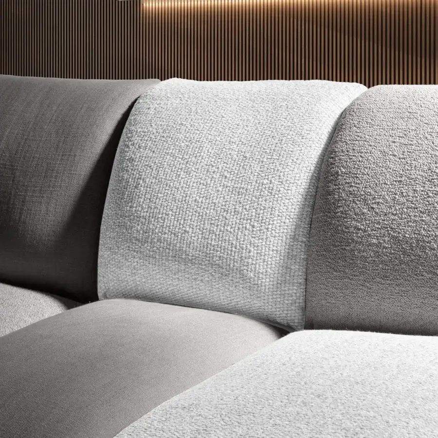 Elegant sectional in dark, medium and light gray textile upholstery, featuring smooth and nubby finishes