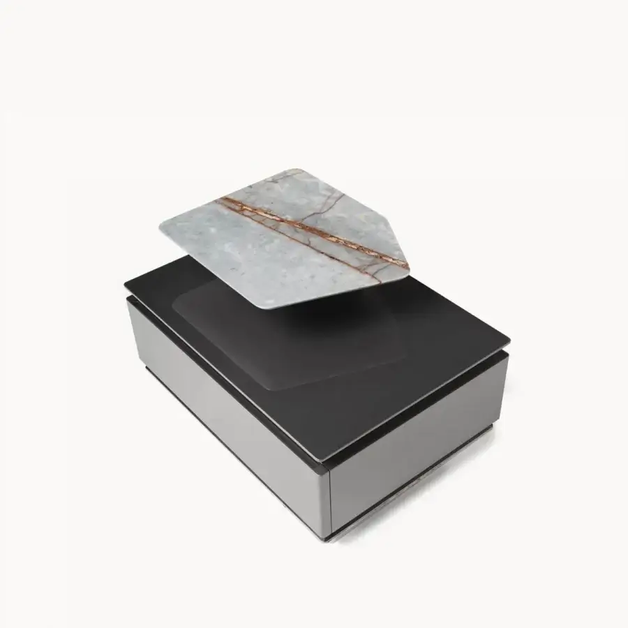 Luxury Visionnaire Prelude nightstand with glossy lacquered wood core, inclined marble plinth, stainless steel profile, dark top, light grey base, floating marble slab veined grey‑white, brown and rust accents