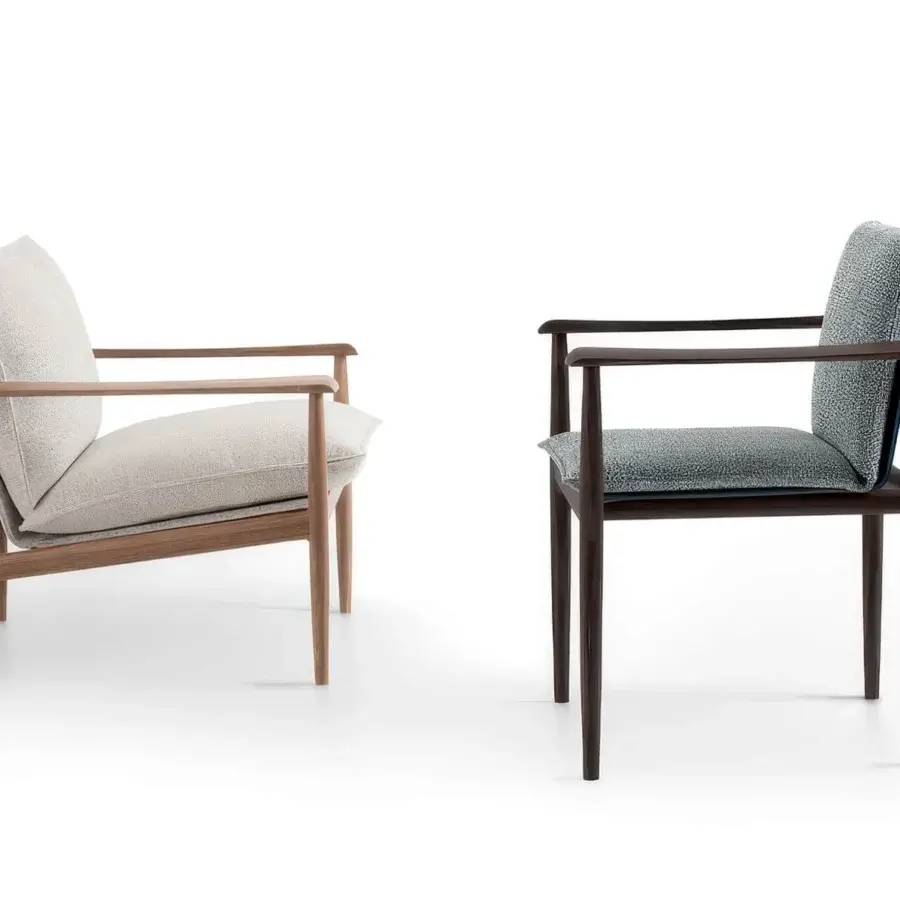 Luxury Giorgetti Kumiki lounge chair with refined Canaletto walnut frame in matte light‑wood tone and cream‑colored cushions