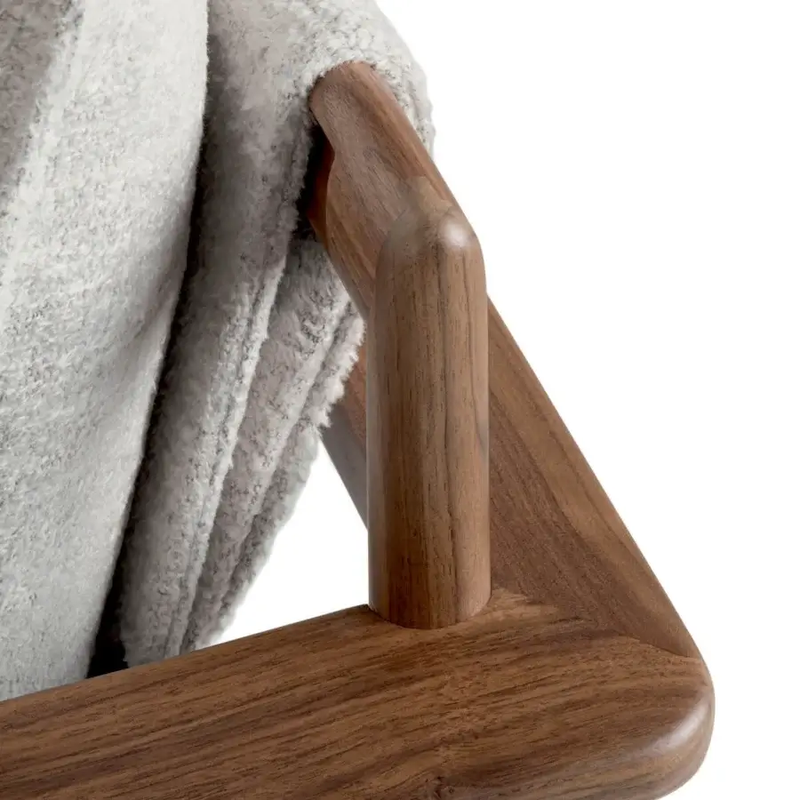 Luxury Giorgetti Kumiki lounge chair with Canaletto walnut frame finished satin, mid‑to‑dark brown tones, exposed joinery, organic silhouette.
