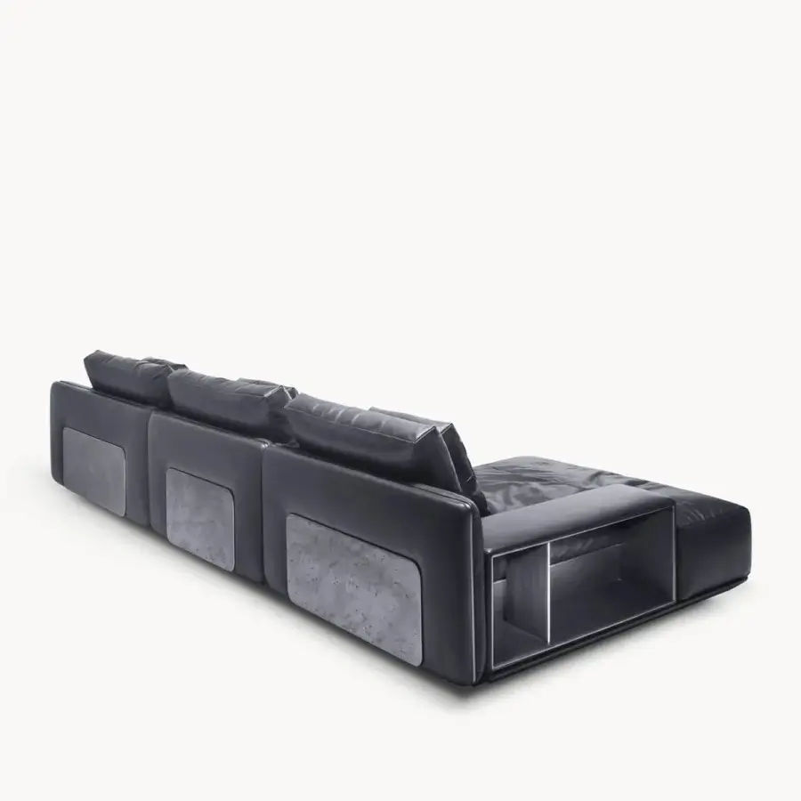 Luxury Visionnaire’s Frame Sectional in deep charcoal grey leather satin finish with matte stone inset panels and integrated shelving niche
