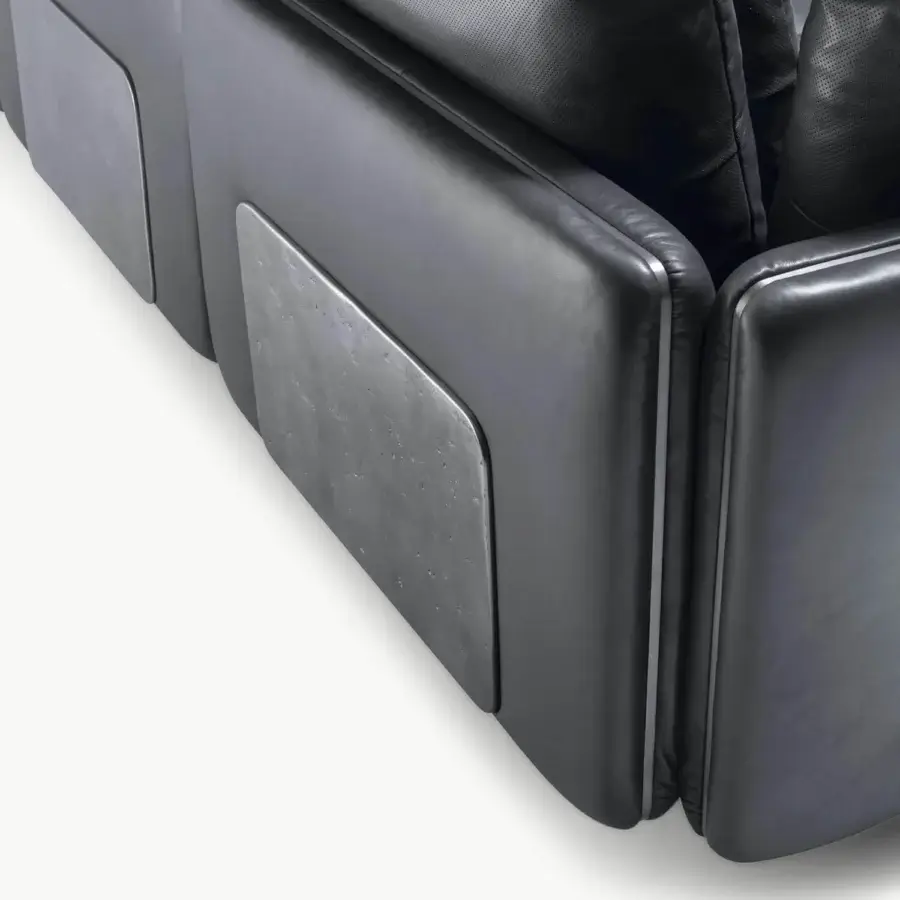 Contemporary Visionnaire Frame Sectional in charcoal‑tinted leather with sleek matte metal inlay, curved edges and perforated cushion