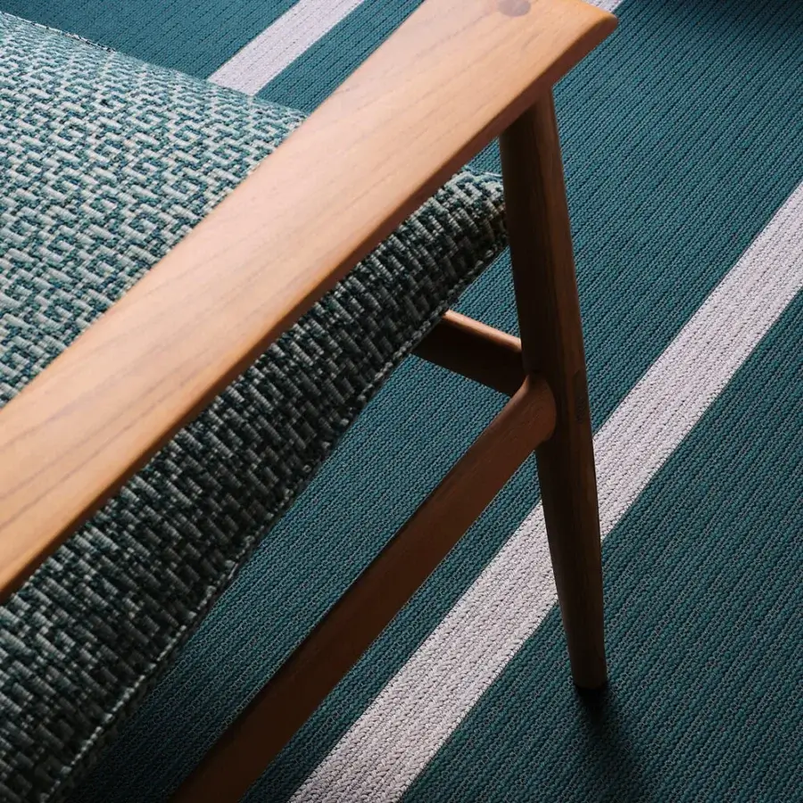 Exquisite Giorgetti Kumiki lounge chair in textured teal fabric with solid teak natural finish and exposed joints
