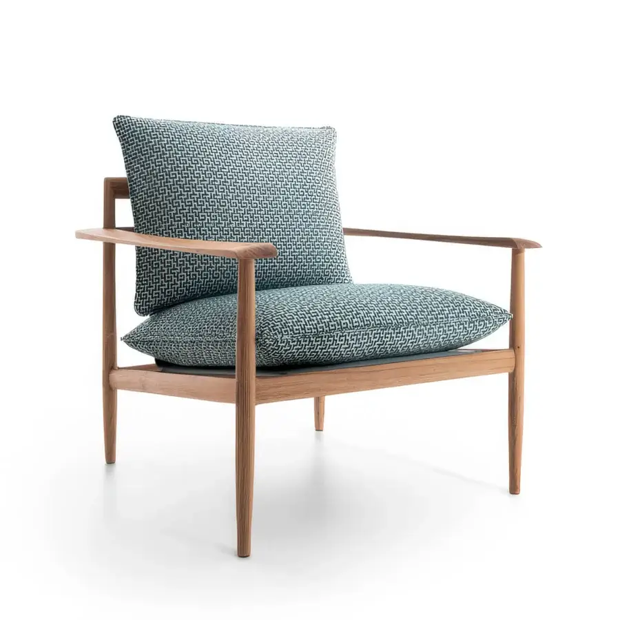 Sleek Giorgetti Kumiki lounge chair with blue and white geometric pattern textile cushions in solid wood natural matte finish