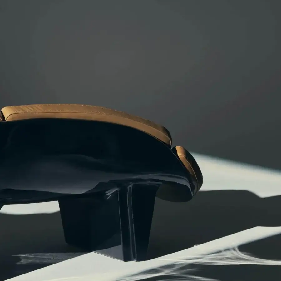 Exquisite Visionnaire Blob sofa in golden-brown leather with robot-sculpted monolithic high-gloss black lacquer shell