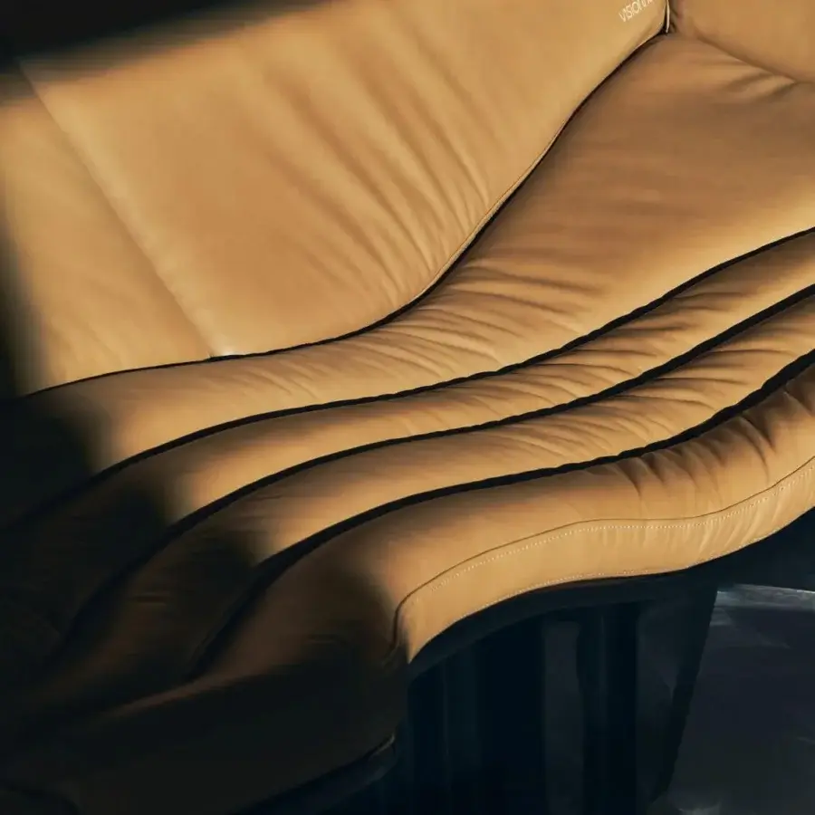 Architectural Visionnaire Blob sofa in tan-camel premium leather with dark brown piping and high-gloss lacquer finish