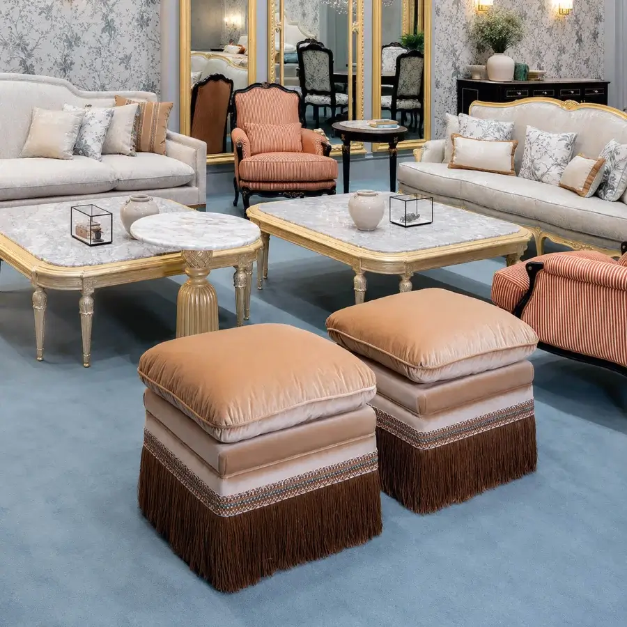 Luxury Bellotti Ezio ottoman in tan/beige velvet with shimmering finish, patterned trim blues whites oranges, dark-brown fringe