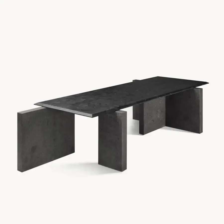 Distinguished Visionnaire Axiom table with dark charcoal stone and textured leather surface built on staggered block bases