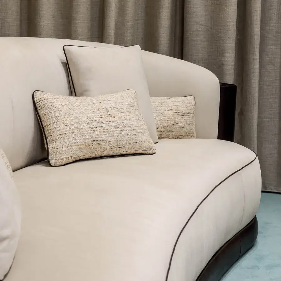 Sophisticated Bellotti Ezio 2026-01 sofa in cream matte Tecnabuk with brown piping, glossy hide base and textured beige gold cushions