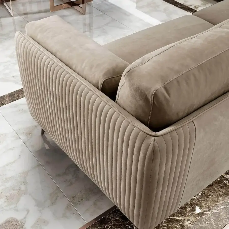 Distinguished DV Home Collection Elite sectional upholstered in smooth matte beige textile with refined Cannetè quilting