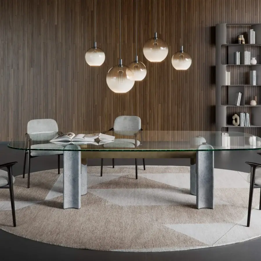 Luxury Cattelan Italia Bilbao Glass Table with oval glass top and cement base with metal cross brace in light grey speckled finish