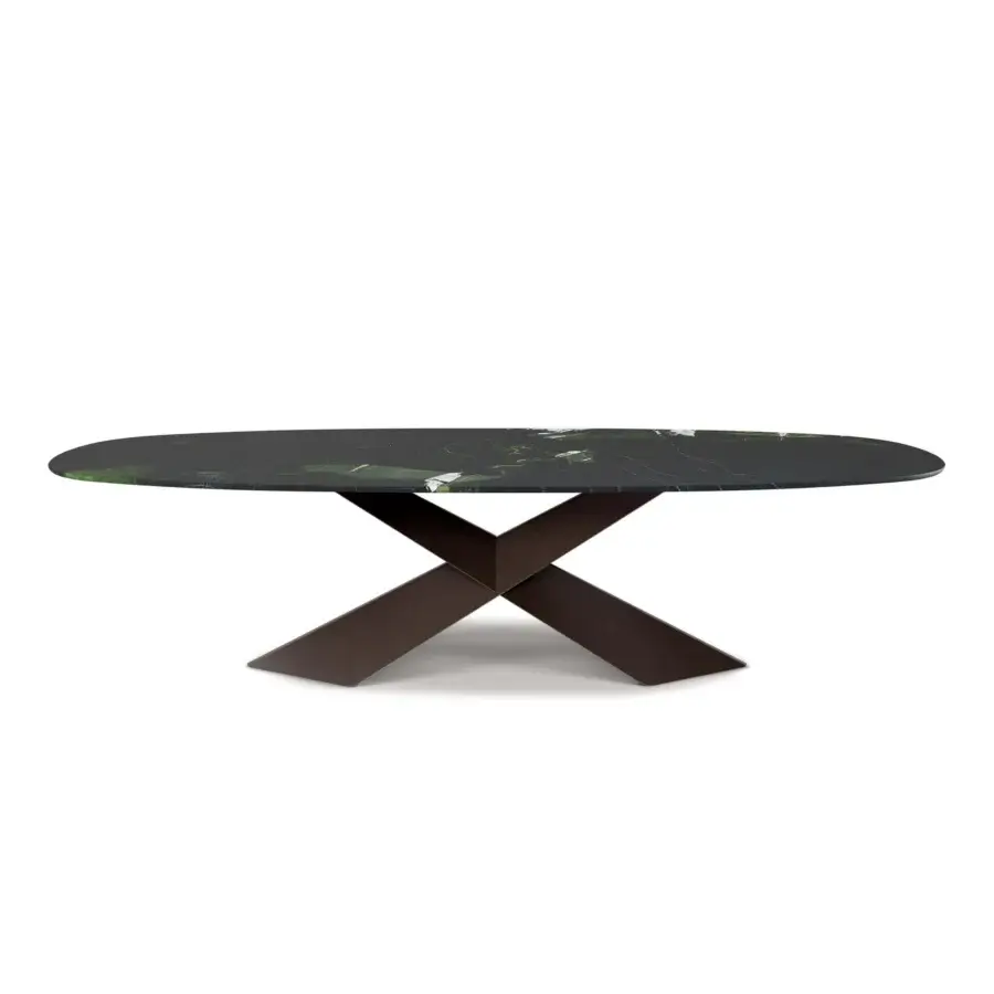Luxury Cattelan Italia Tyron Marble Table with polished dark green‑black Lepanto stone top and deep bronze X‑shaped steel support