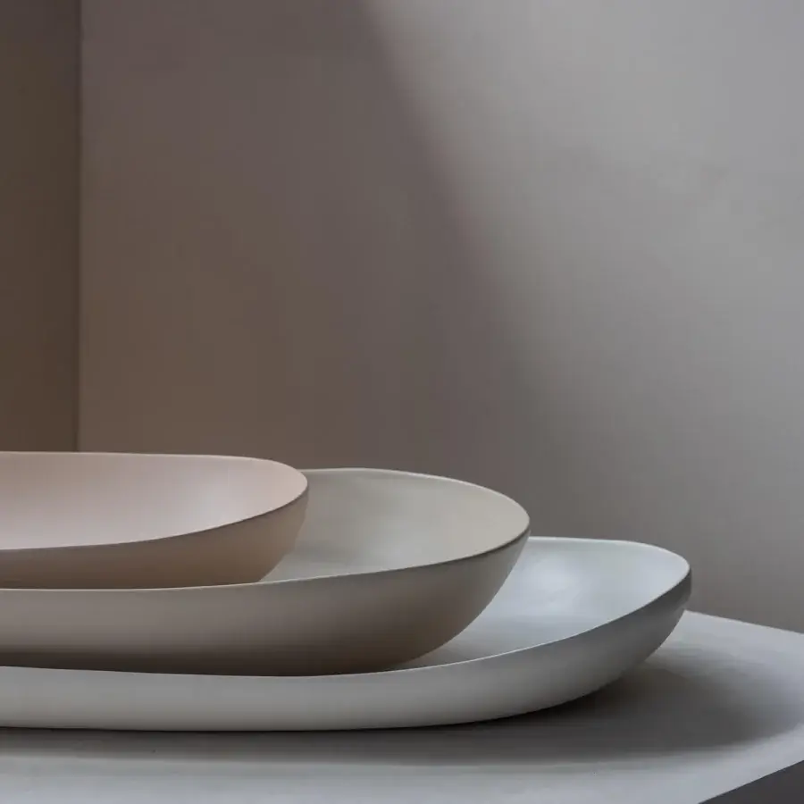 Premium Rina Menardi Conche Centerpiece of baked clay bowls in warm beige, light off‑white, cool light grey with soft organic curves