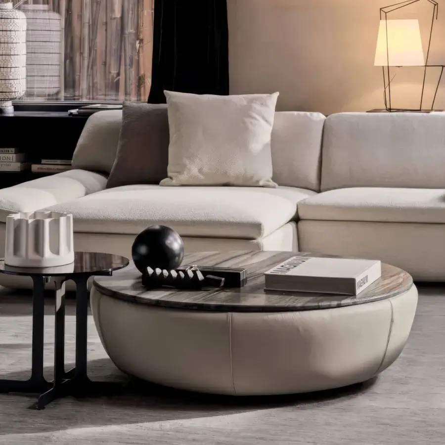 Elegant Ditre Italia Deck coffee table with grey‑white marble‑like veining, off‑white upholstered base, glossy finish