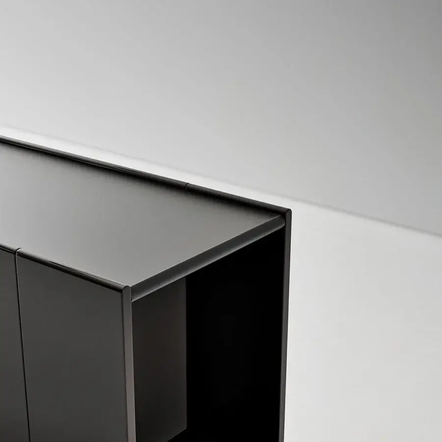 Luxury Bonaldo Spy sideboard lacquered wood glossy black surface reflecting high‑contrast highlights minimalistic geometric lines sharp vertical divider
