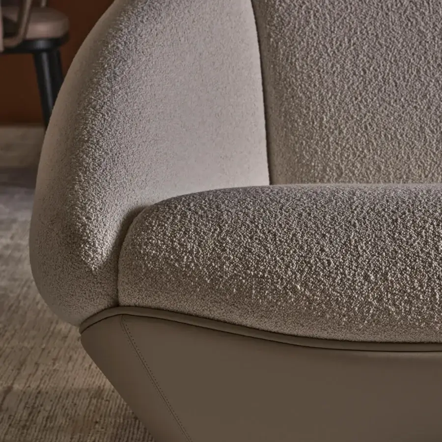 Sumptuous Rugiano Iside low profile sectional with fluid curved lines in light taupe fabric and muted tan leather base