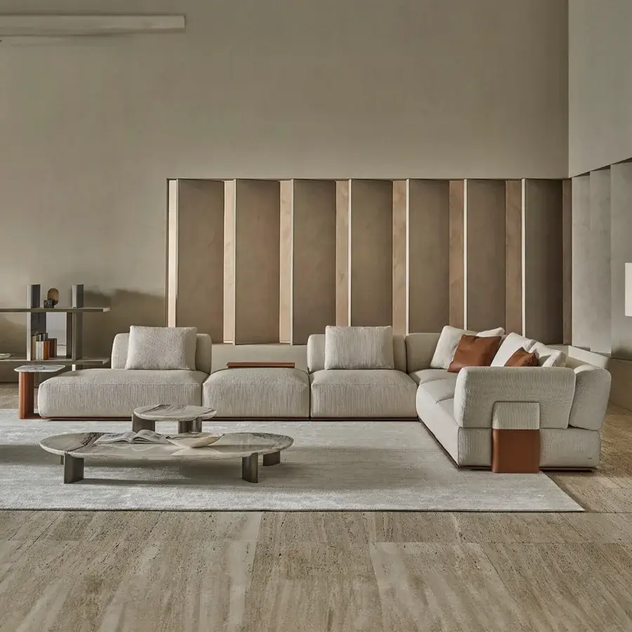 Elegant Rugiano Hatton sectional upholstered in beige textile with leather-wrapped base plus cognac brown cushions and armrest