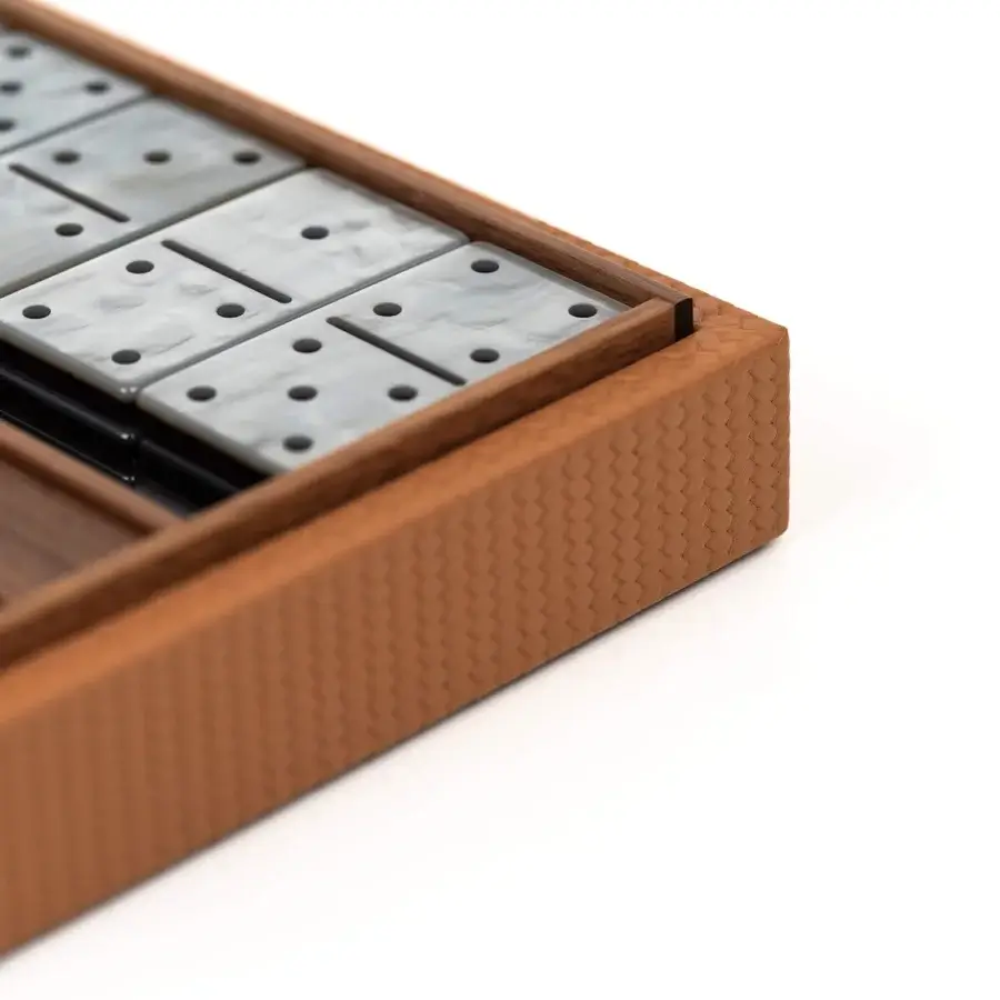 Luxury Pinetti dominoes set with walnut‑wood case, woven paneling, matte finish, off‑white resin tiles grey swirls dark dots