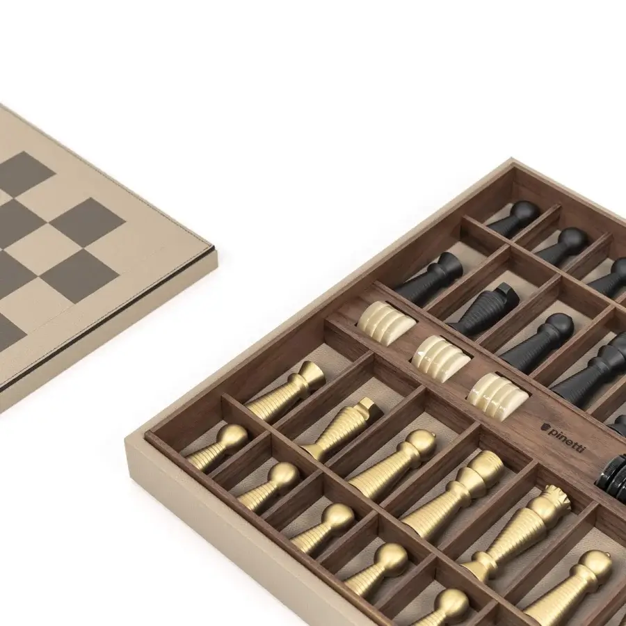 Elegant board game with walnut wood and leather trim, light beige/tan and deep brown/dark grey squares, gold‑brass and black pieces.