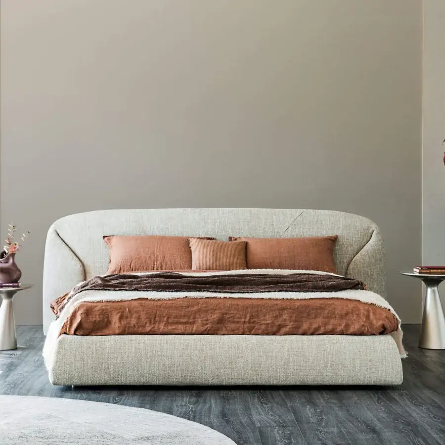 Luxury Richard Bed by Cattelan Italia sculptural low‑profile silhouette upholstered light beige fabrics and fine leathers floating platform