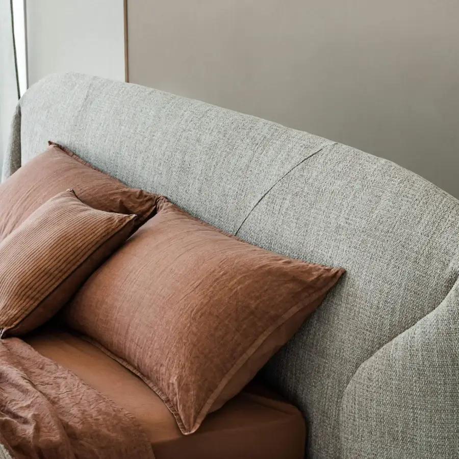 Contemporary Cattelan Italia Richard Bed upholstered in light greige fabric with softly curved sculptural headboard