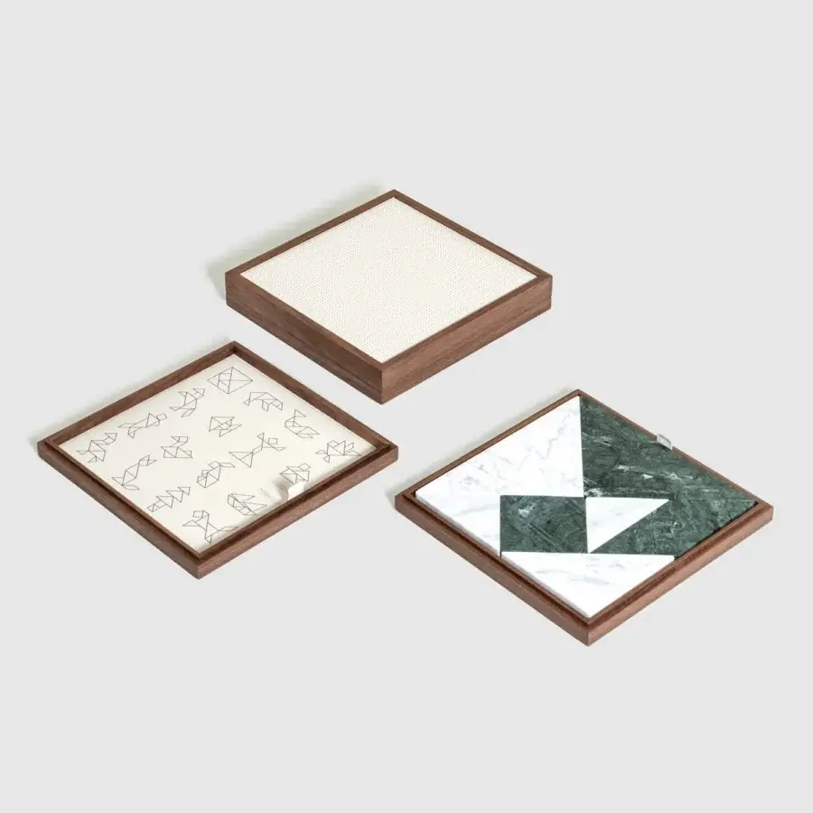 Premium Pinetti Tangram Box with walnut wood frame, satin‑matte grain, white linen lining, and marble triangles squares parallelograms
