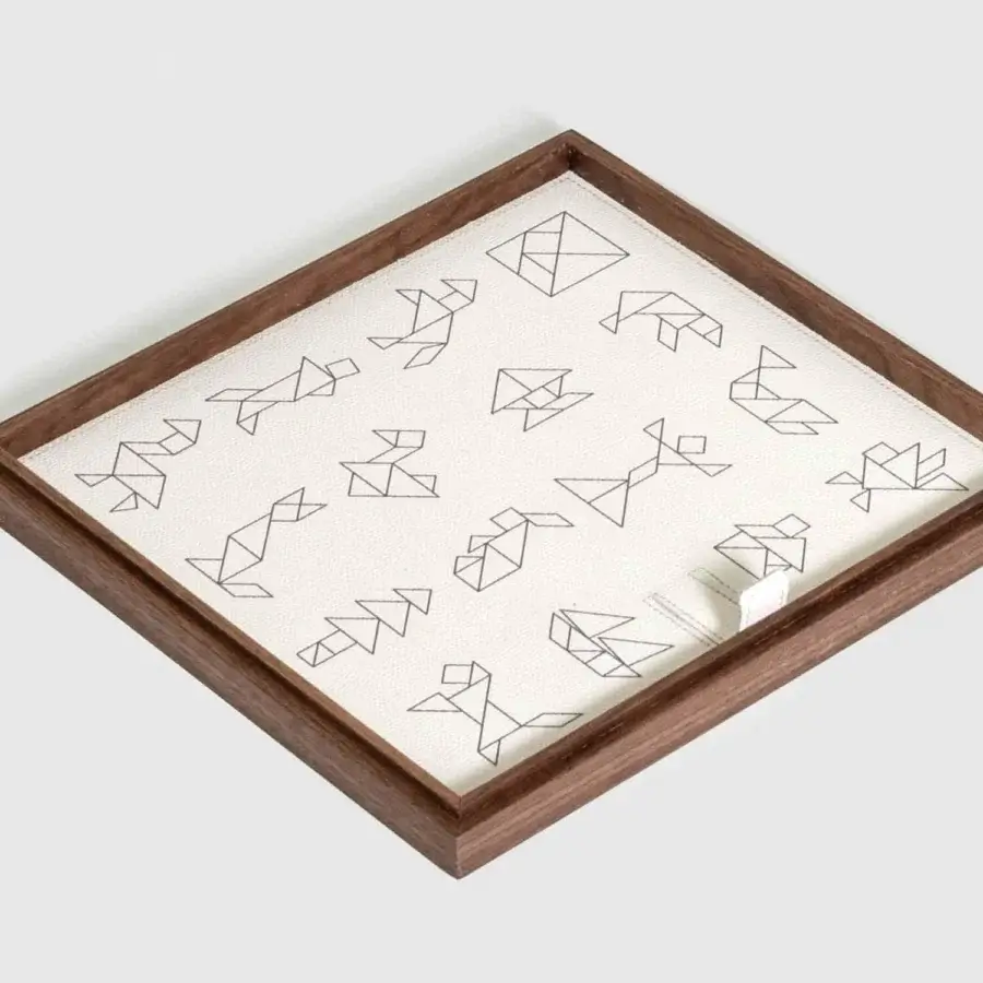 Elegant Pinetti Tangram Box Canaletto walnut wood frame, leather upholstery, board with black line‑art figures, matte grain