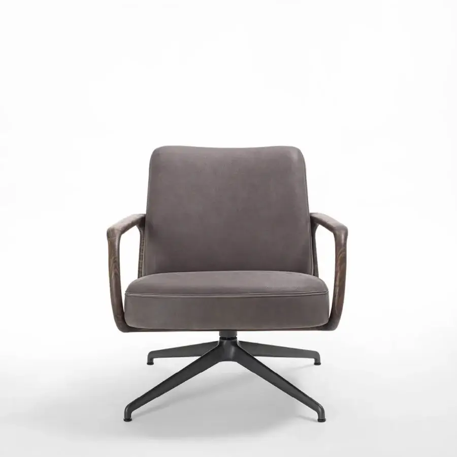 Elegant Porada Cuna lounge chair upholstered in muted grayish‑brown textile, wooden shell, matte black metal base.