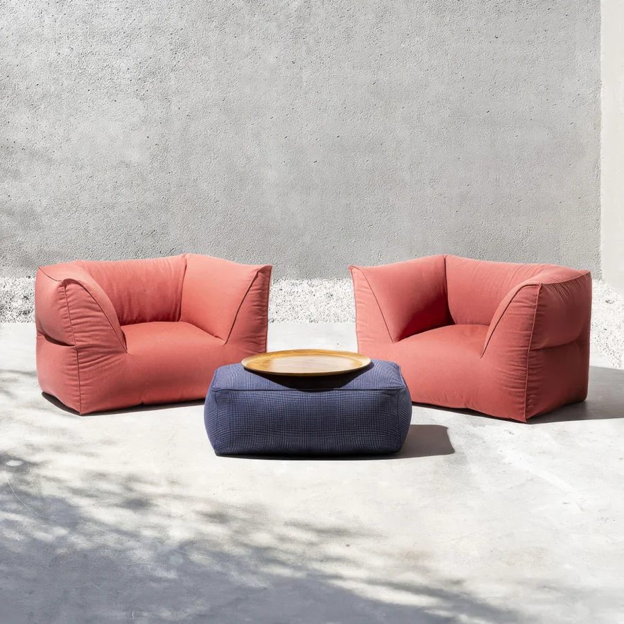 Elegant Gart Puffone lounge chair within coral‑red with microsphere padding and polyester flakes in durable outdoor fabric