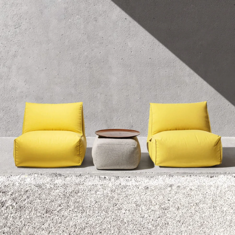 Elegant Gart Puffone Lounge Chair with bright yellow high-performance outdoor fabric and integrated side pocket