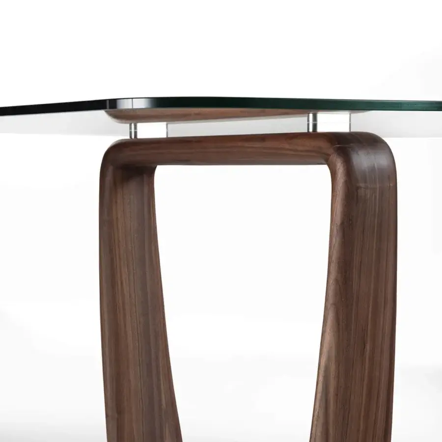Elegant Porada Saddle table of deep-brown walnut and clear glass, balanced by silver connectors seamlessly.