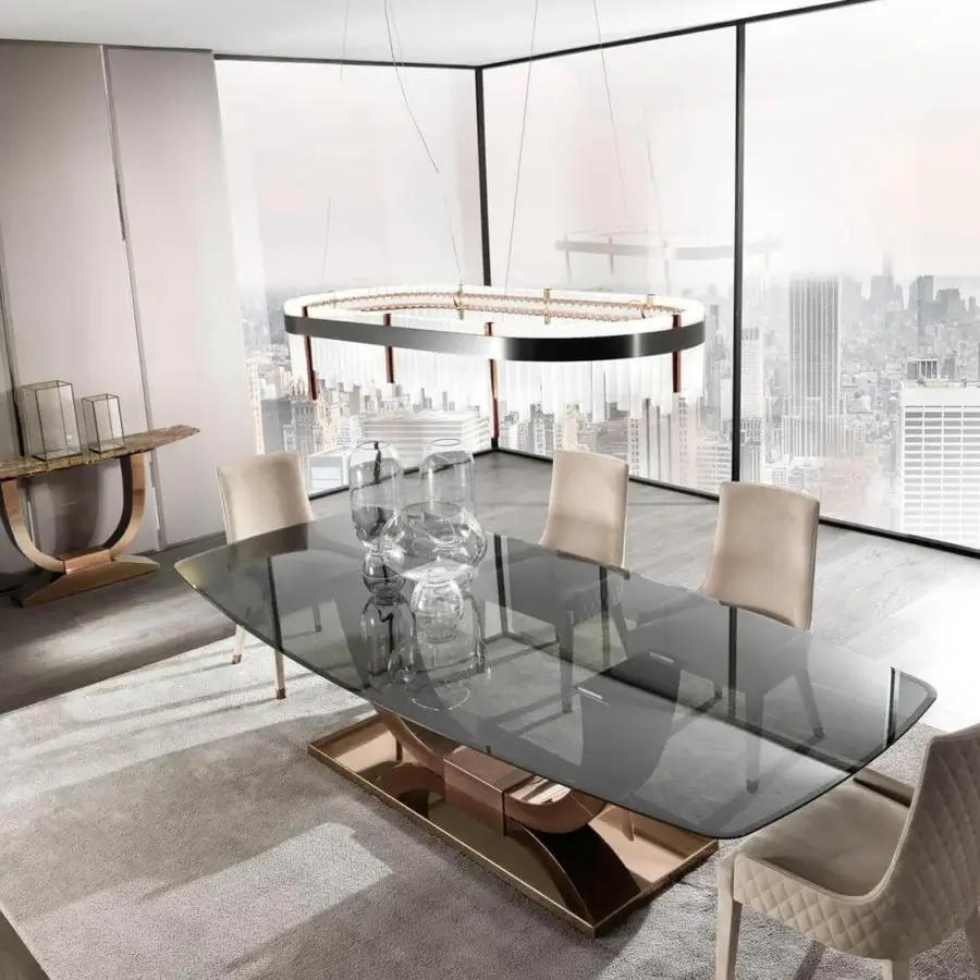 Exclusive DV Home Collection Heritage table with transparent glass top and glossy golden stainless steel base