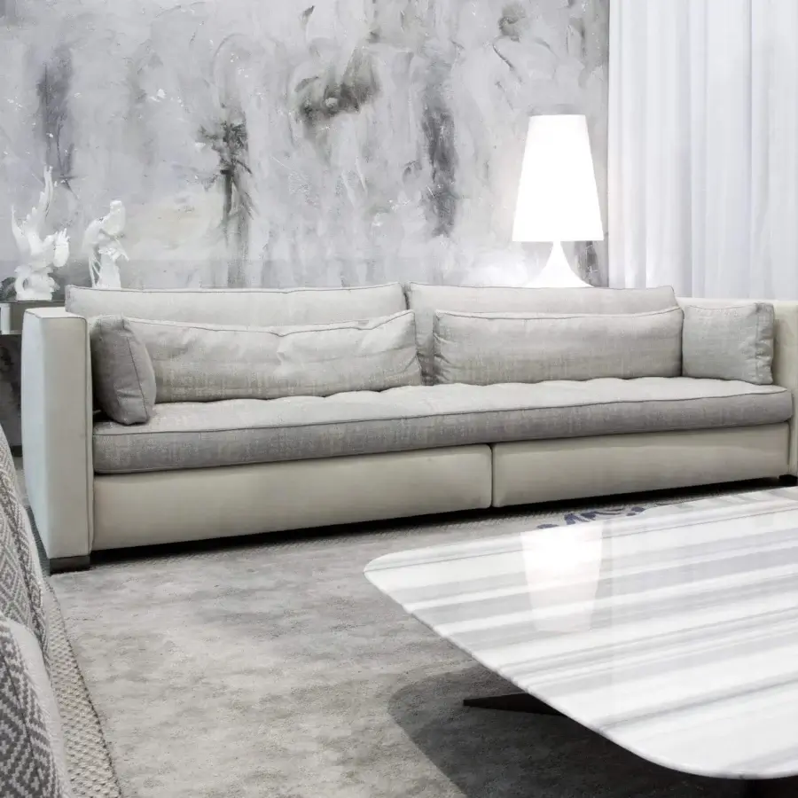 Distinguished Erba Alchimia sofa with light gray textile upholstery and a contrasting lighter base crafted with solid wood frames