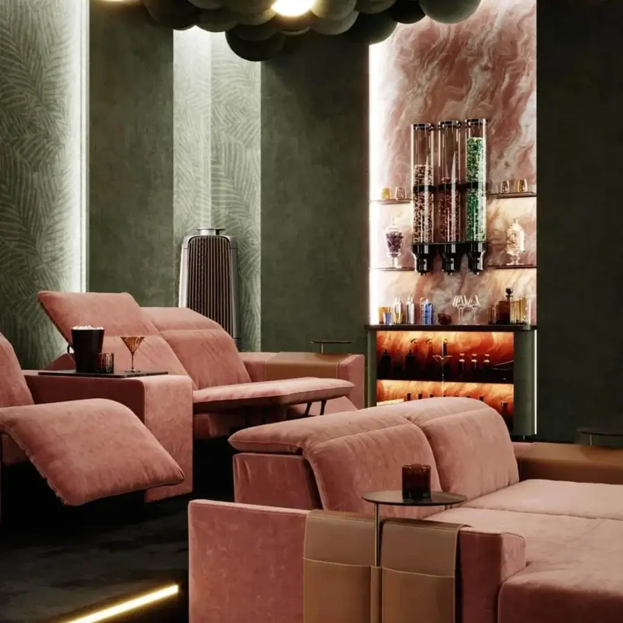 Elegant Vismara Kubrik home cinema seating upholstered in pinkish-coral textile with a double reclining mechanism and keyboard control