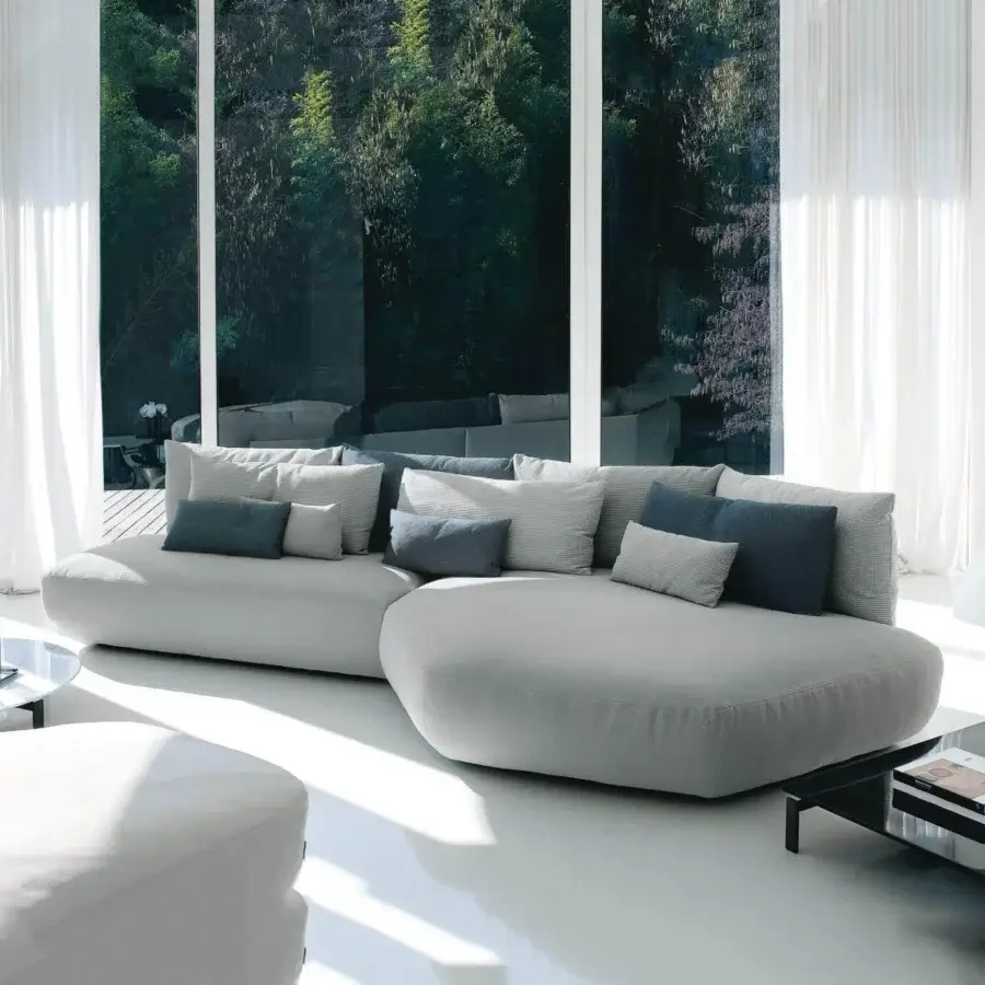 Distinguished Swan Italia Pack sectional with light gray velvet upholstery and included gray and blue feather-filled cushions