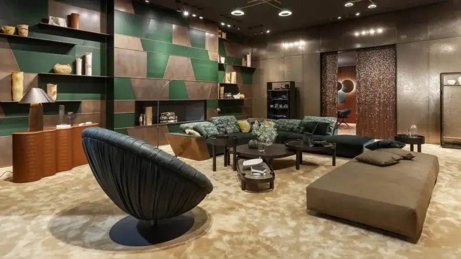 Luxury Laurameroni Metropol sectional in forest-green velvet, bronze panel, lacquered wooden frame, black base