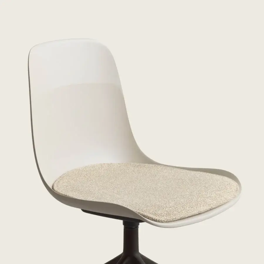 Distinguished Kristalia Elephantino chair with off‑white recycled plastic shell, beige textured cushion and bucket backrest