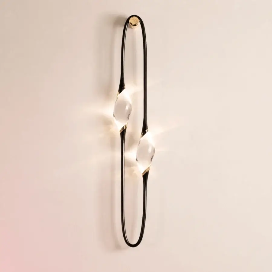 Luxury Il Pezzo Mancante 12 wall lamp with slender brass frame, engraved serial, crystal diffusers, and warm radiance