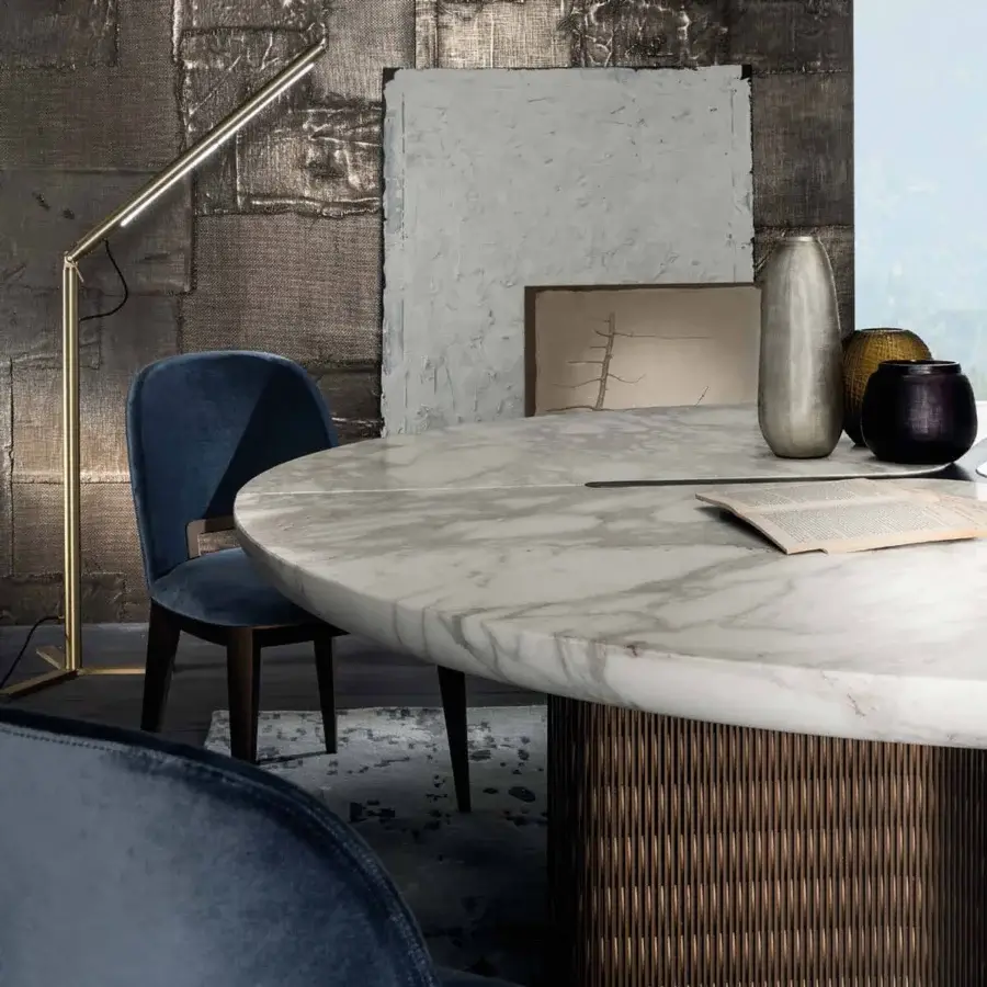 Elegant Laurameroni Infinity Table with white marble top and burnished brass rosette on bronze‑tinted honeycomb base
