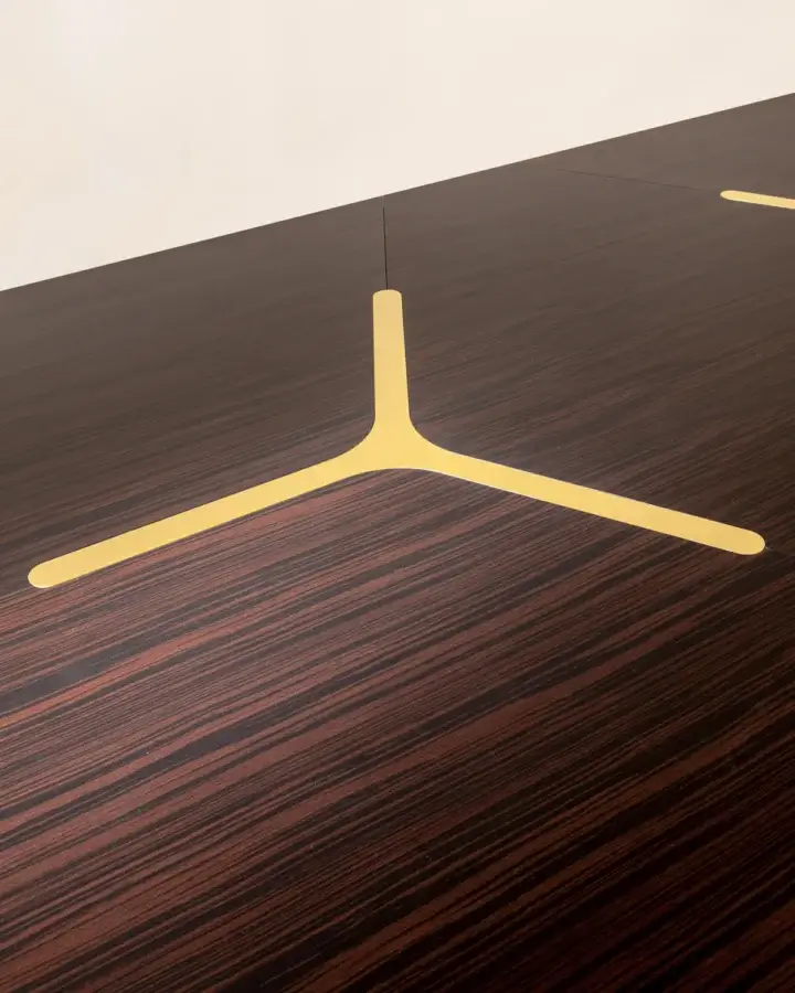 Premium Laurameroni Infinity Air table with modular dark wood top and burnished brass rosettes contrasting deep brown grain