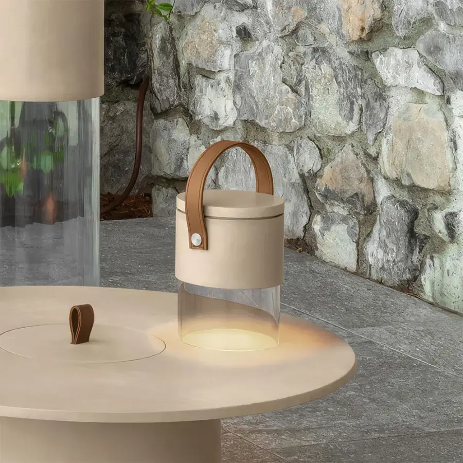 Prestige Talenti Kukà Table Lamp with matte beige upper body, clear methacrylate base, brown leather‑like handle, rivet