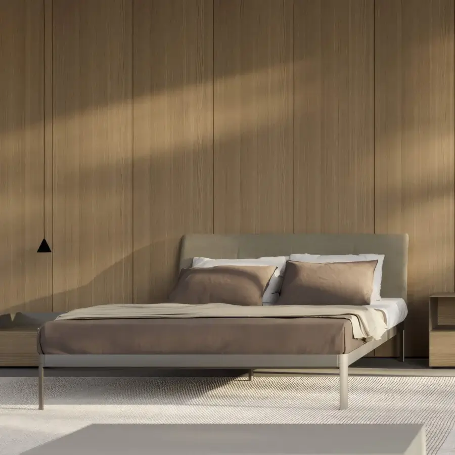 Elegant Kristalia AluAlu Bed with lacquered light gray metal frame, textured muted taupe headboard, slender cylindrical legs