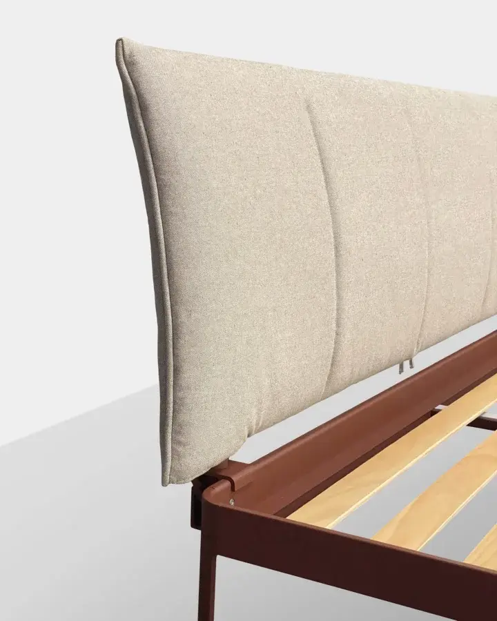 Luxury Kristalia AluAlu Bed with beige‑cream textured fabric headboard, matte reddish‑brown metal frame, and wood slats