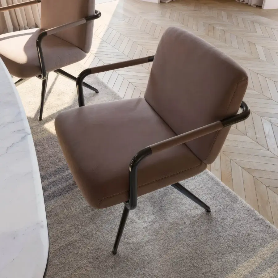 Luxury CPRN Homood Barry armchair with matte black metal frame and muted taupe‑brown upholstery, sculptural silhouette